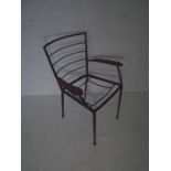 A mid-century metal framed office chair
