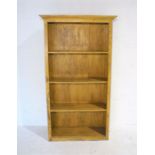 A painted freestanding bookcase, length 100cm, height 180cm.