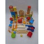 A collection of Pintoy dolls house furniture including bed, wardrobe, bath, cooker, fridge