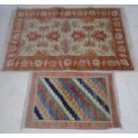 An Afghan rug 143cm x 91cm plus one other.