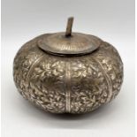An Eastern silver lidded pot in the form of a pumpkin 18cm width roughly 14cm total height