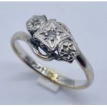 An 18ct gold and platinum diamond 3 stone ring with illusion setting , weight 3g
