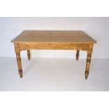 A pine farmhouse table with single drawer, length 138cm, width 86cm, height 73cm.
