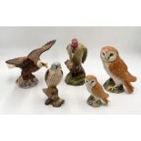 A collection of five Beswick large birds comprising of Bald Eagle 1018, Woodpecker 1218, Kestral