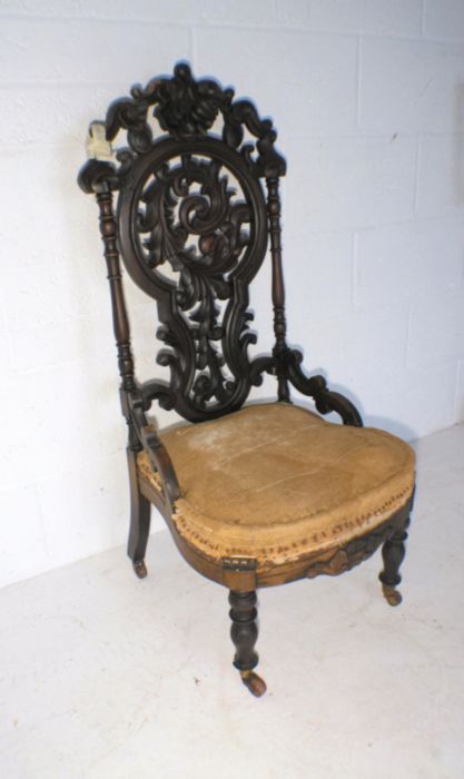 A Victorian nursing chair, with carved Black Forest style decoration to back - in need of - Image 3 of 4