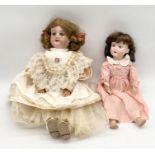 Two antique Armand Marseille bisque headed dolls one numbered 390