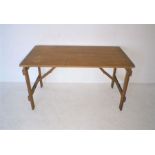 A pine trestle table, length 136cm, width 69cm, height 76cm.