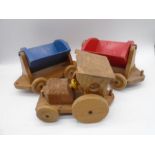 A hand-crafted wooden train with two wagons