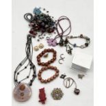 A small collection of costume jewellery including silver heart shaped locket on chain etc.