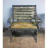 A cast iron framed garden bench with wooden slat seating, marked 'Glasdon', length 69cm, height