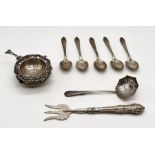 A small collection of hallmarked silver cutlery along with a silver strainer on stand (A/F)