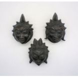 Three bronze Punu (Gabon) tribal masks, possibly 19th Century, height 17/18cm