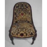 A Victorian upholstered nursing chair.