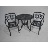A garden bistro set comprising of a table and two chairs