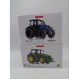 Two boxed Wiking die-cast tractors including a Valtra T214 and John Deere 8R 410 (both 1:32 scale)