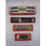 A collection of four boxed Hornby OO gauge model railway trains including "Oliver Cromwell"
