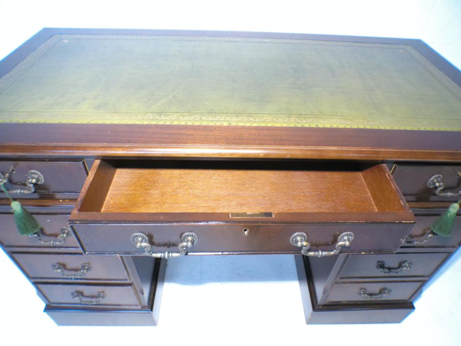 A reproduction mahogany kneehole desk, with green leather inset top, length 121cm, depth 61cm, - Image 5 of 6