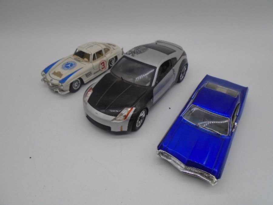 A collection of die-cast cars including 19 Corgi Olympic 2012 boxing London Black Taxi's, Maisto - Image 2 of 8