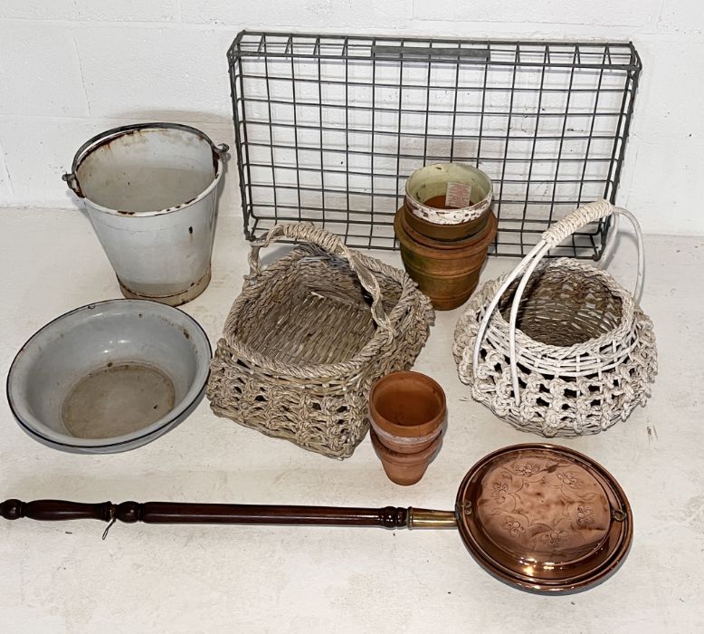 An assortment of items including terracotta pots, enamel bucket, galvanised tray, two wicker baskets