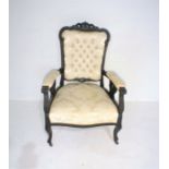 A turn of the century French armchair with button-back detailing