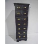 A tall and narrow painted chest of nine drawers. 42cm x 50cm height 150cm