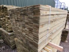 LARGE PACK OF PRESSURE TREATED FEATHER EDGE TIMBER FENCE CLADDING BOARDS. SIZE: 1.80M LENGTH X 1