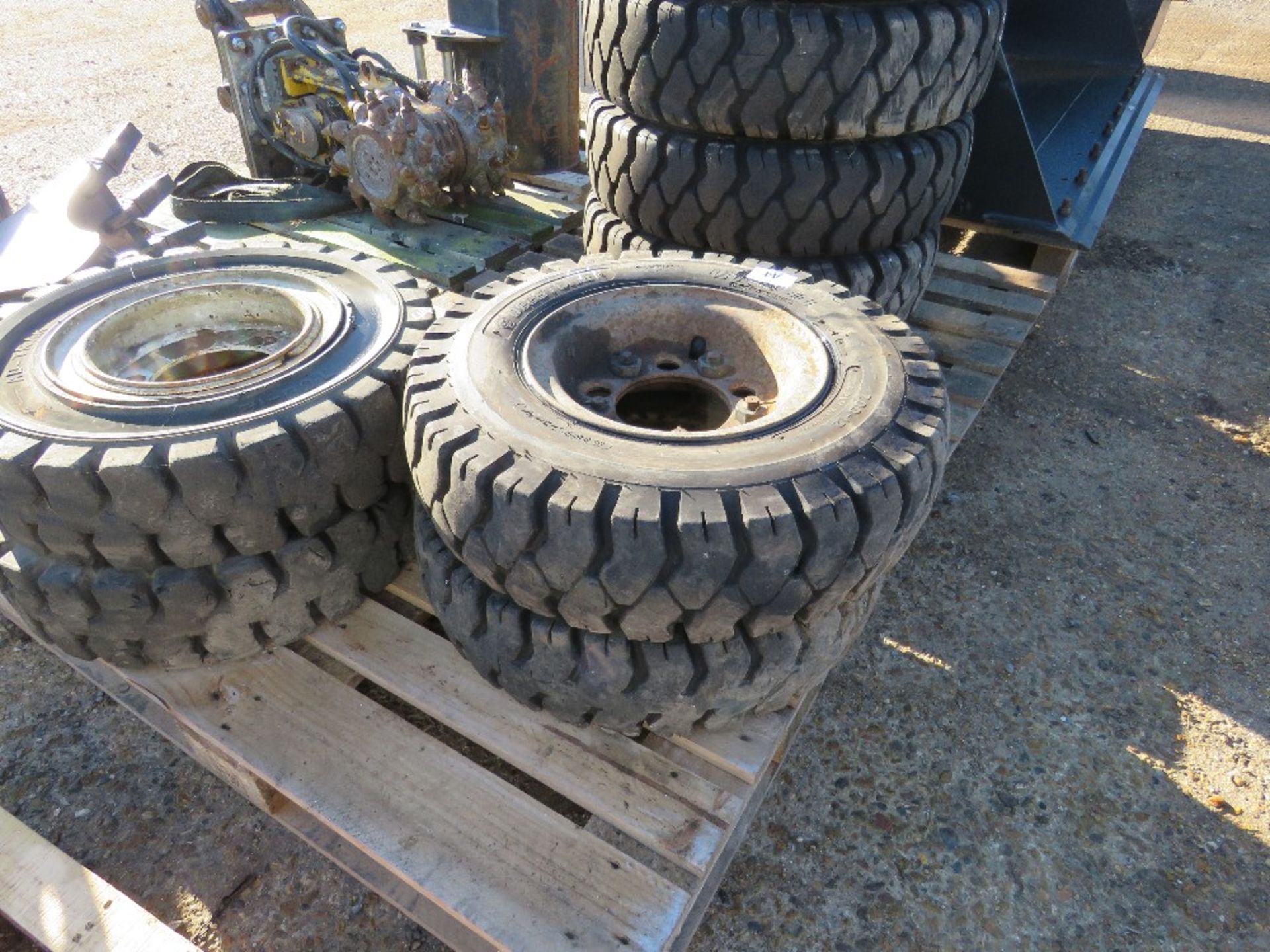 SET OF 4 FORKLIFT WHEELS AND TYRES 7.00-12. THIS LOT IS SOLD UNDER THE AUCTIONEERS MARGIN SCHEME,