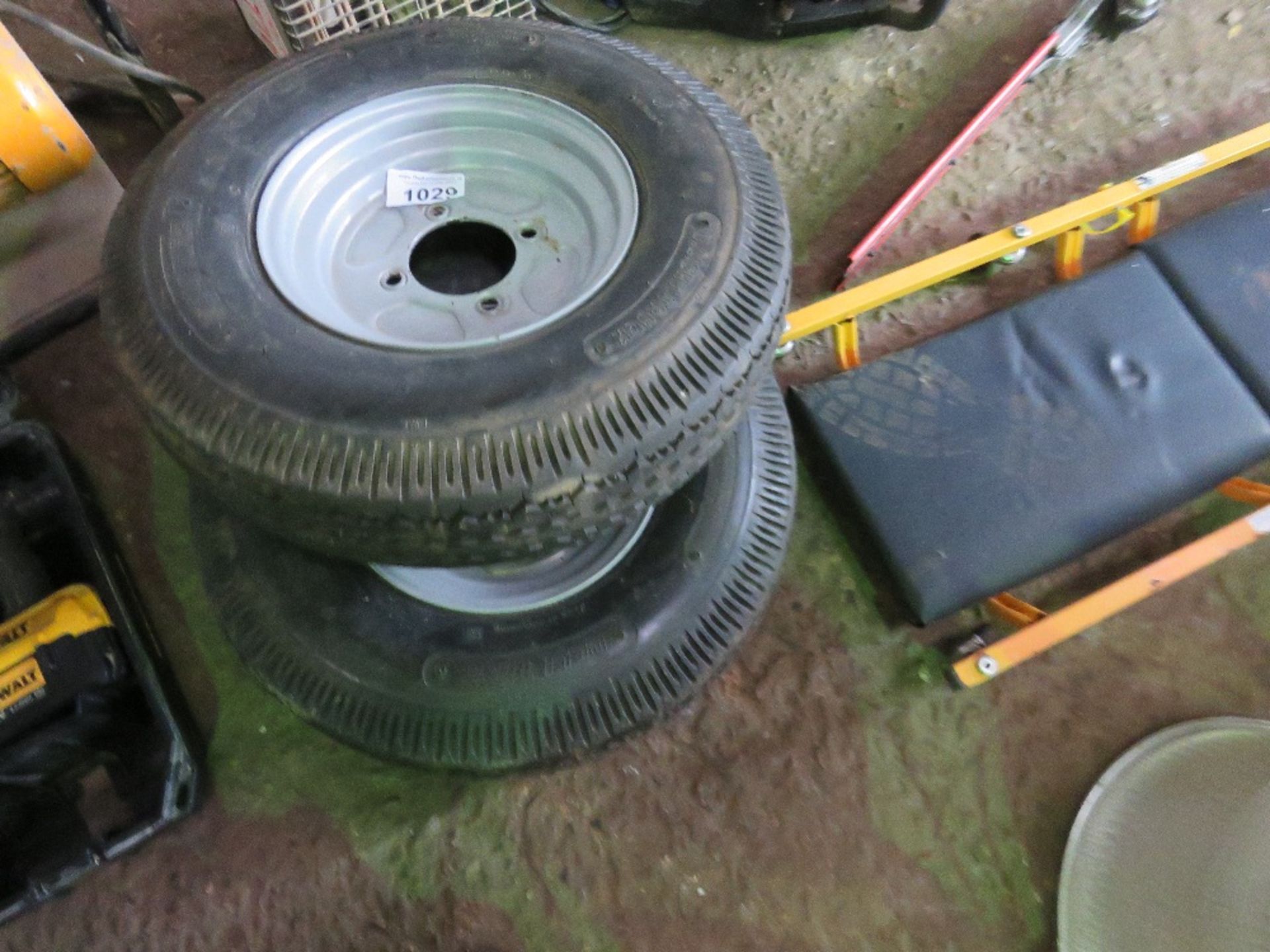 2 X TRAILER WHEELS AND TYRES 5.00 X 10. THIS LOT IS SOLD UNDER THE AUCTIONEERS MARGIN SCHEME, THEREF