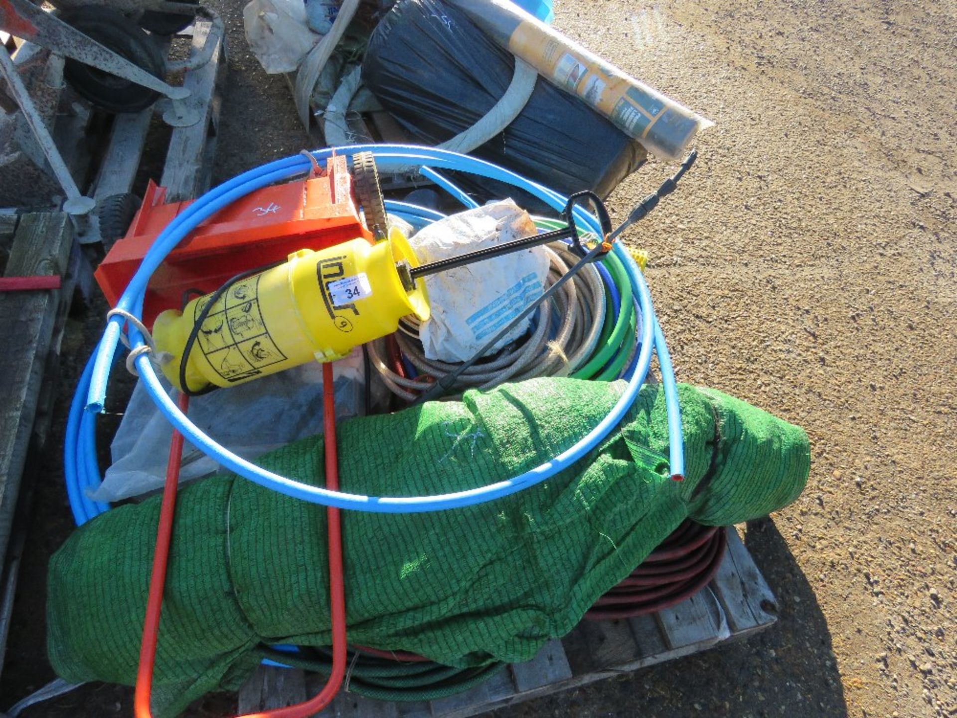 PALLET OF HOSES, HAND SPRAYERS, SPREADER UNIT AND GREEN SHEETING ETC.THIS LOT IS SOLD UNDER THE AUCT