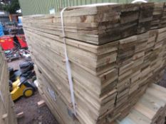 LARGE PACK OF PRESSURE TREATED FEATHER EDGE TIMBER FENCE CLADDING BOARDS. SIZE: 1.65M LENGTH X 1