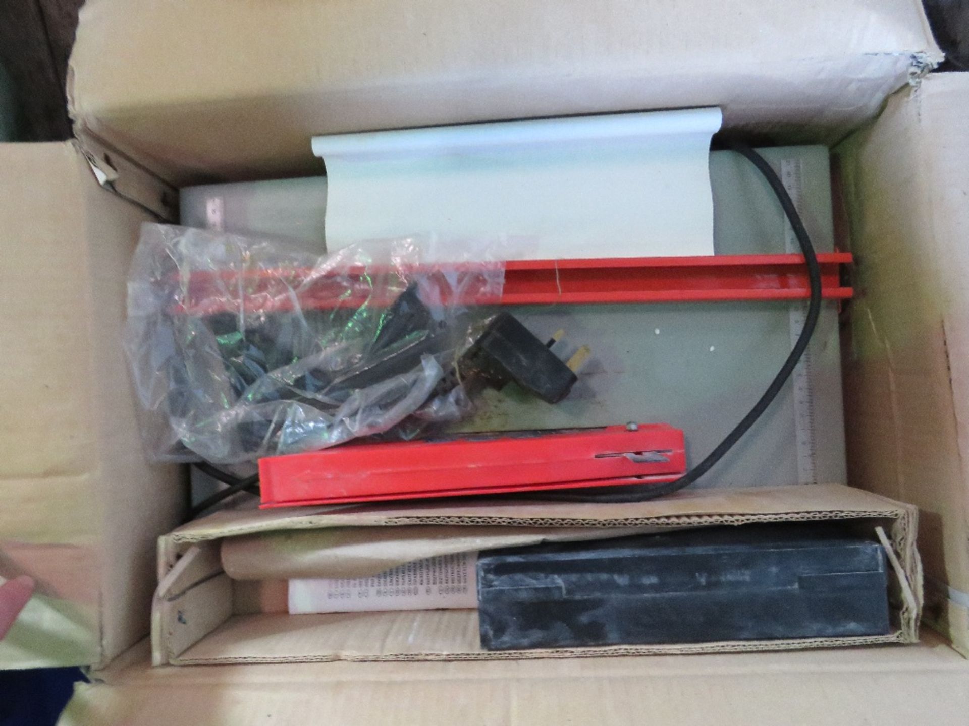 TILE SAWBENCH, 240VOLT IN BOX. THIS LOT IS SOLD UNDER THE AUCTIONEERS MARGIN SCHEME, THEREFORE NO VA