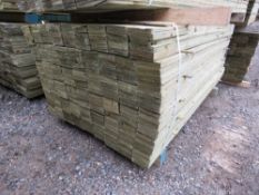 LARGE PACK OF PRESSURE TREATED FEATHER EDGE TIMBER FENCE CLADDING BOARDS. SIZE: 1.65M LENGTH X 1