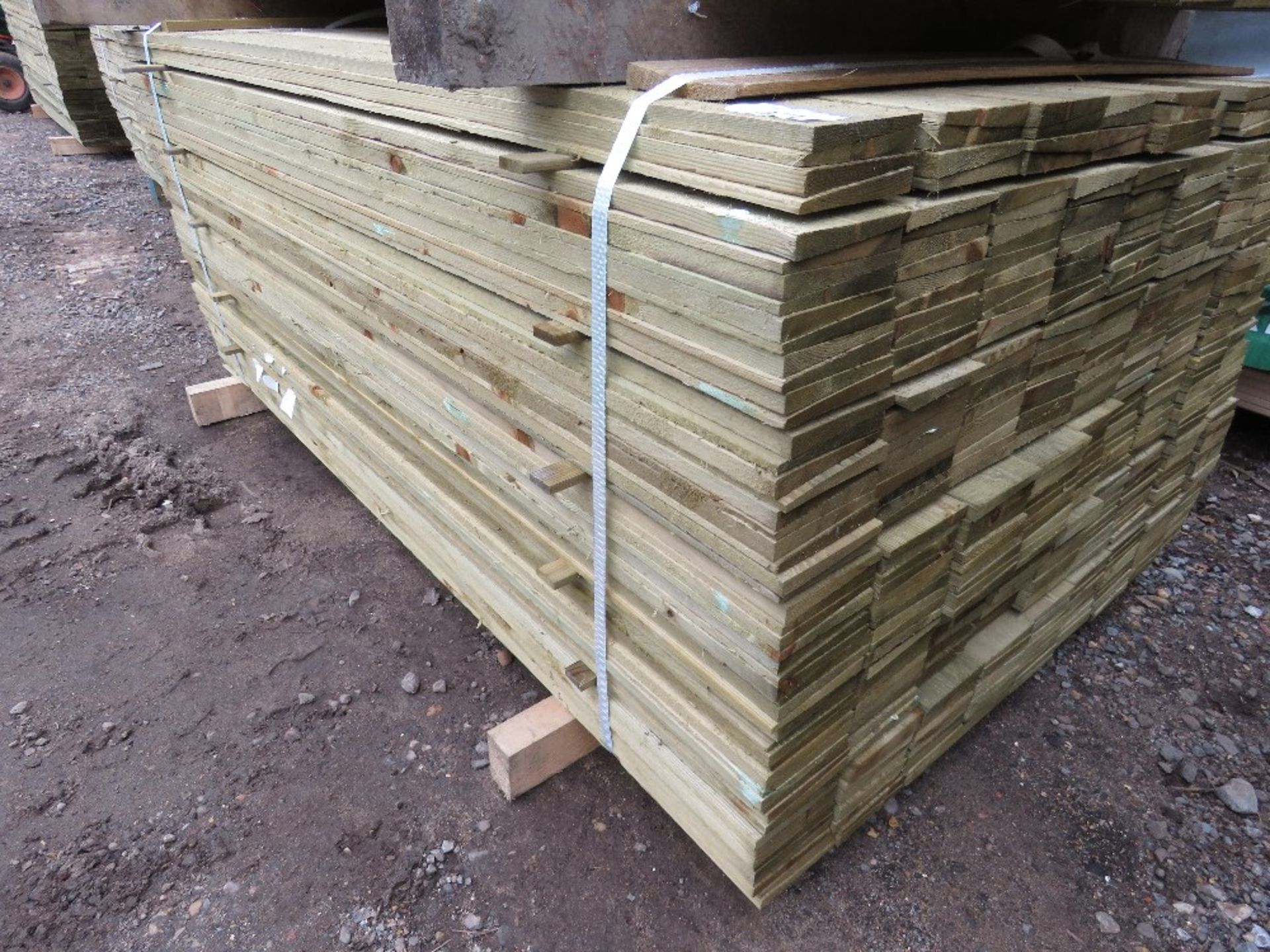 PACK OF PRESSURE TREATED FEATHER EDGE TIMBER FENCE CLADDING BOARDS. SIZE: 1.50M LENGTH X 100MM W