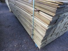 LARGE BUNDLE OF PRESSURE TREATED HIT AND MISS TIMBER CLADDING: 1.73M LENGTH X 10CM WIDTH APPROX.