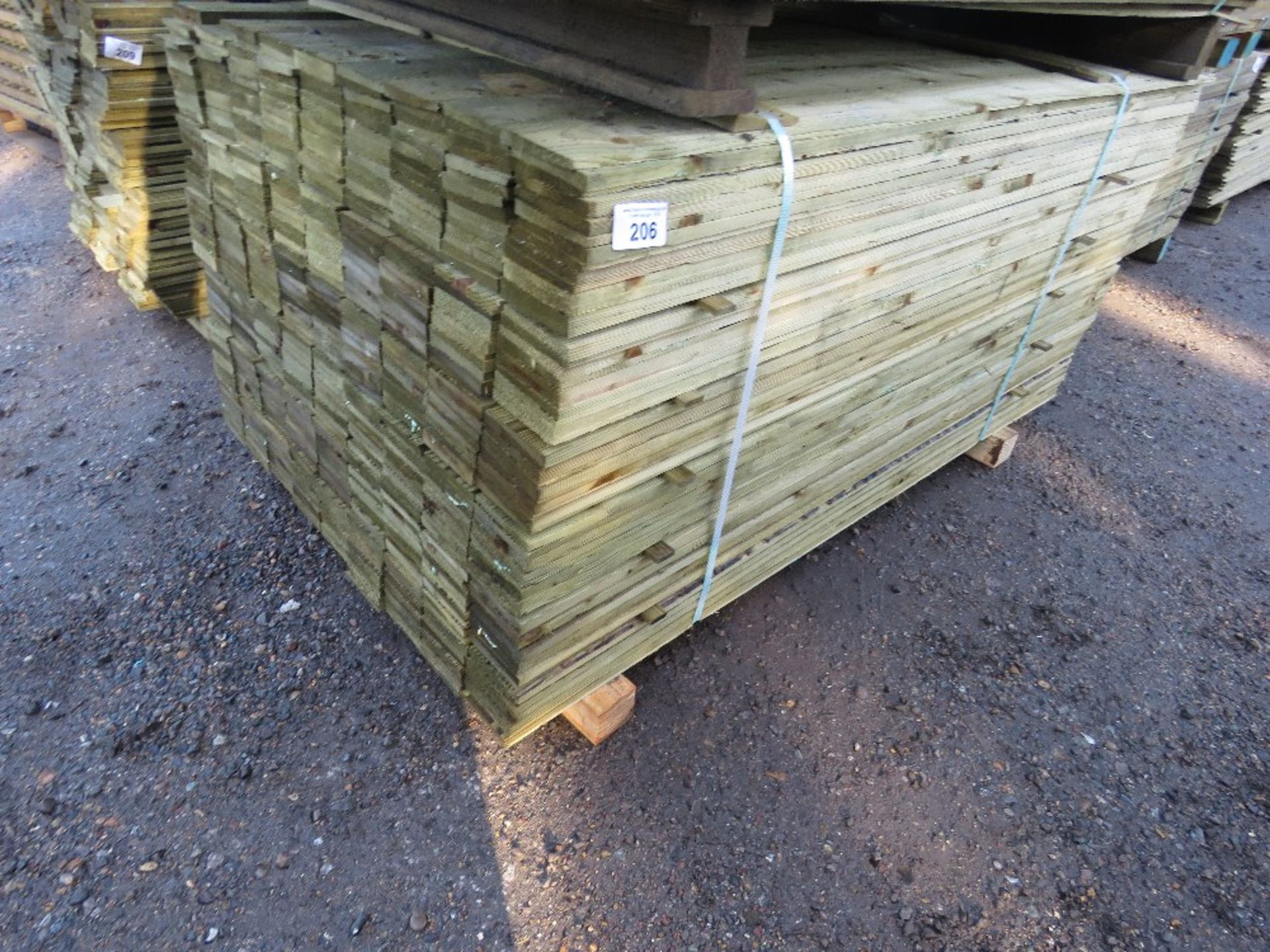 LARGE BUNDLE OF PRESSURE TREATED FEATHER EDGE TIMBER CLADDING: 1.65M LENGTH X 10CM WIDTH APPROX.