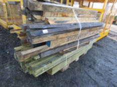 LARGE STACK OF ASSORTED TIMBERS AND POSTS.