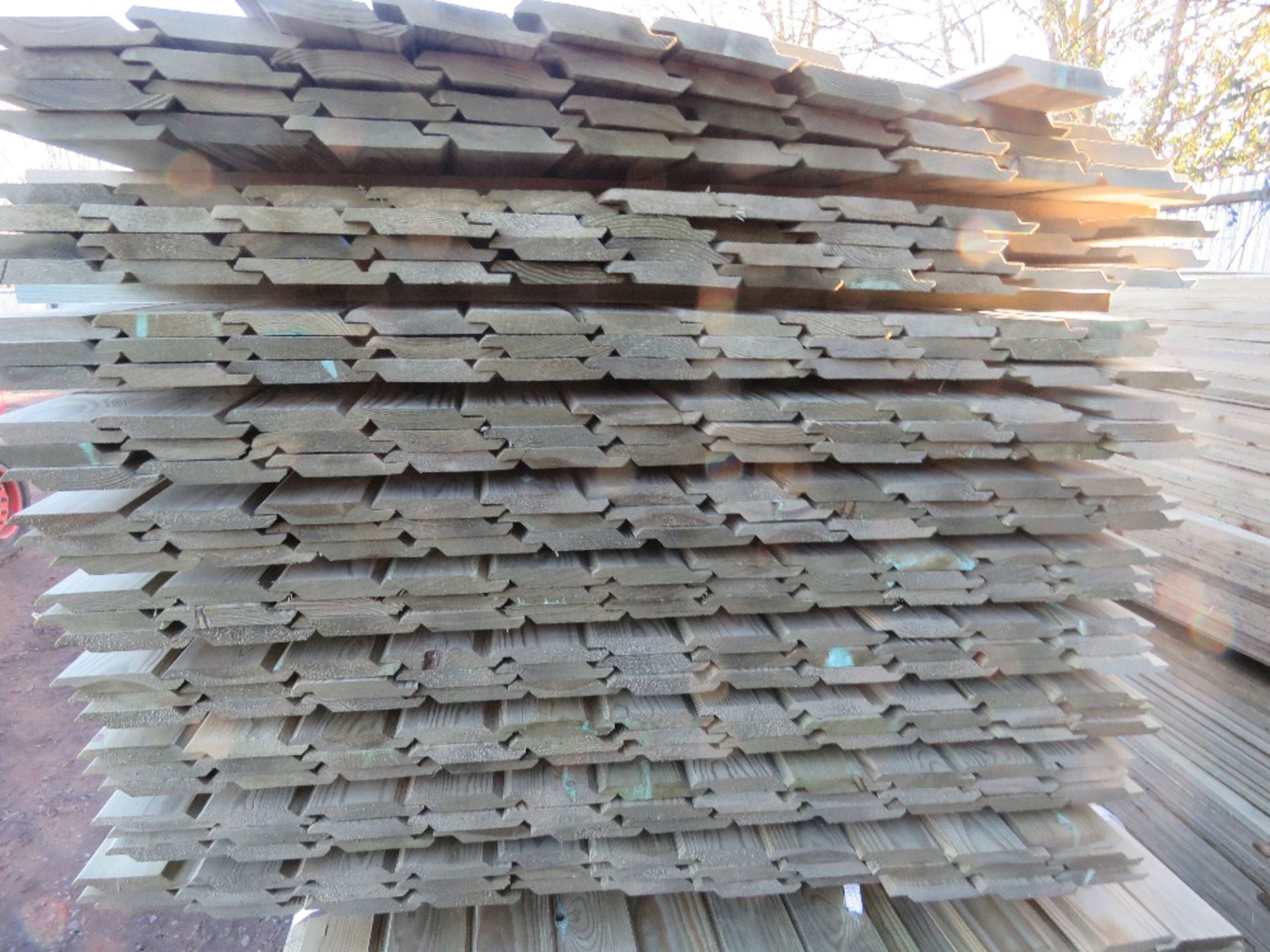 LARGE PACK OF TREATED SHIPLAP FENCE CLADDING TIMBER BOARDS. SIZE: 1.73M LENGTH X 10CM WIDTH APPROX. - Image 2 of 3