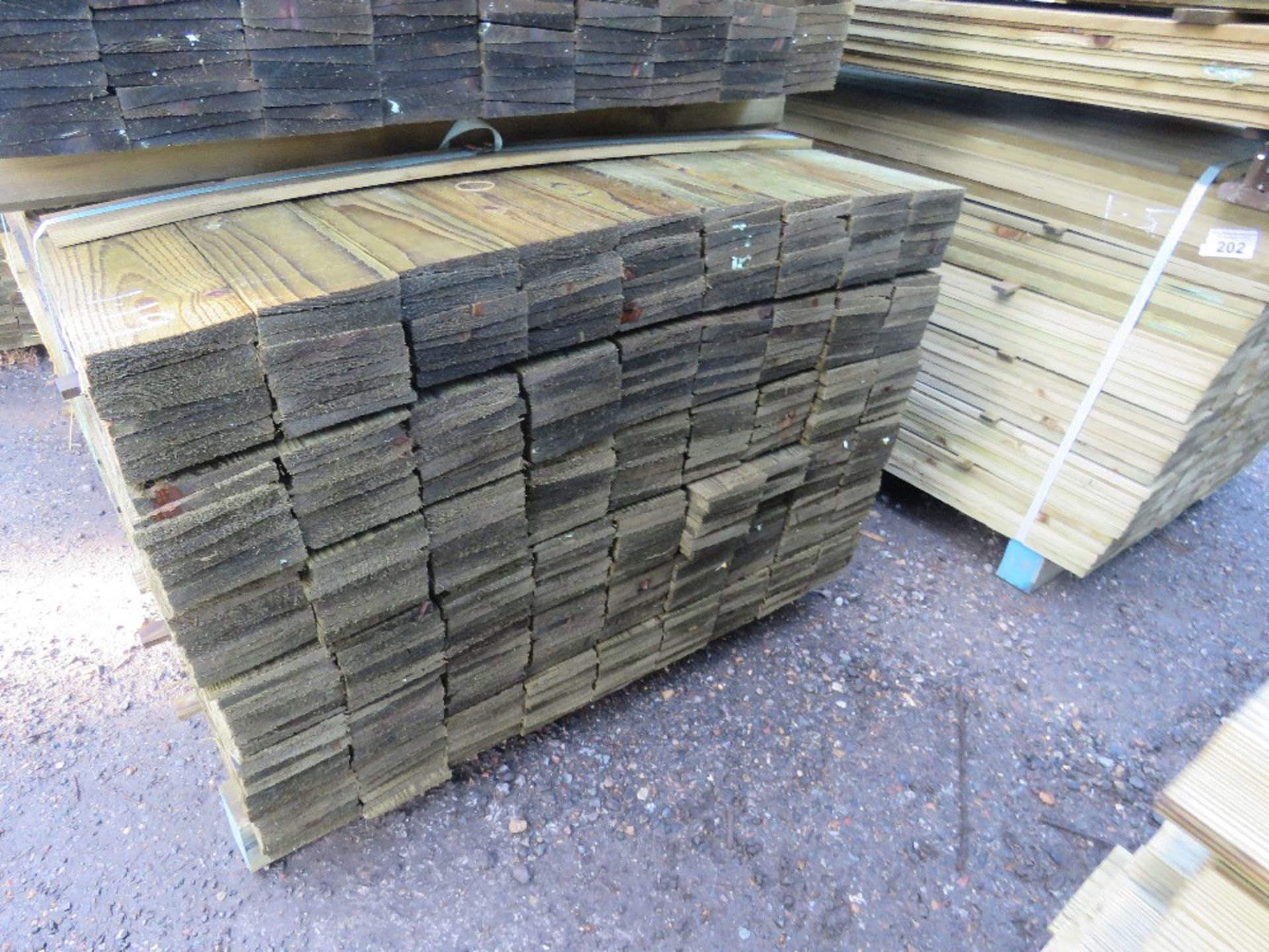 LARGE BUNDLE OF PRESSURE TREATED FEATHER EDGE TIMBER CLADDING: 1.2M LENGTH X 10CM WIDTH APPROX. - Image 2 of 3