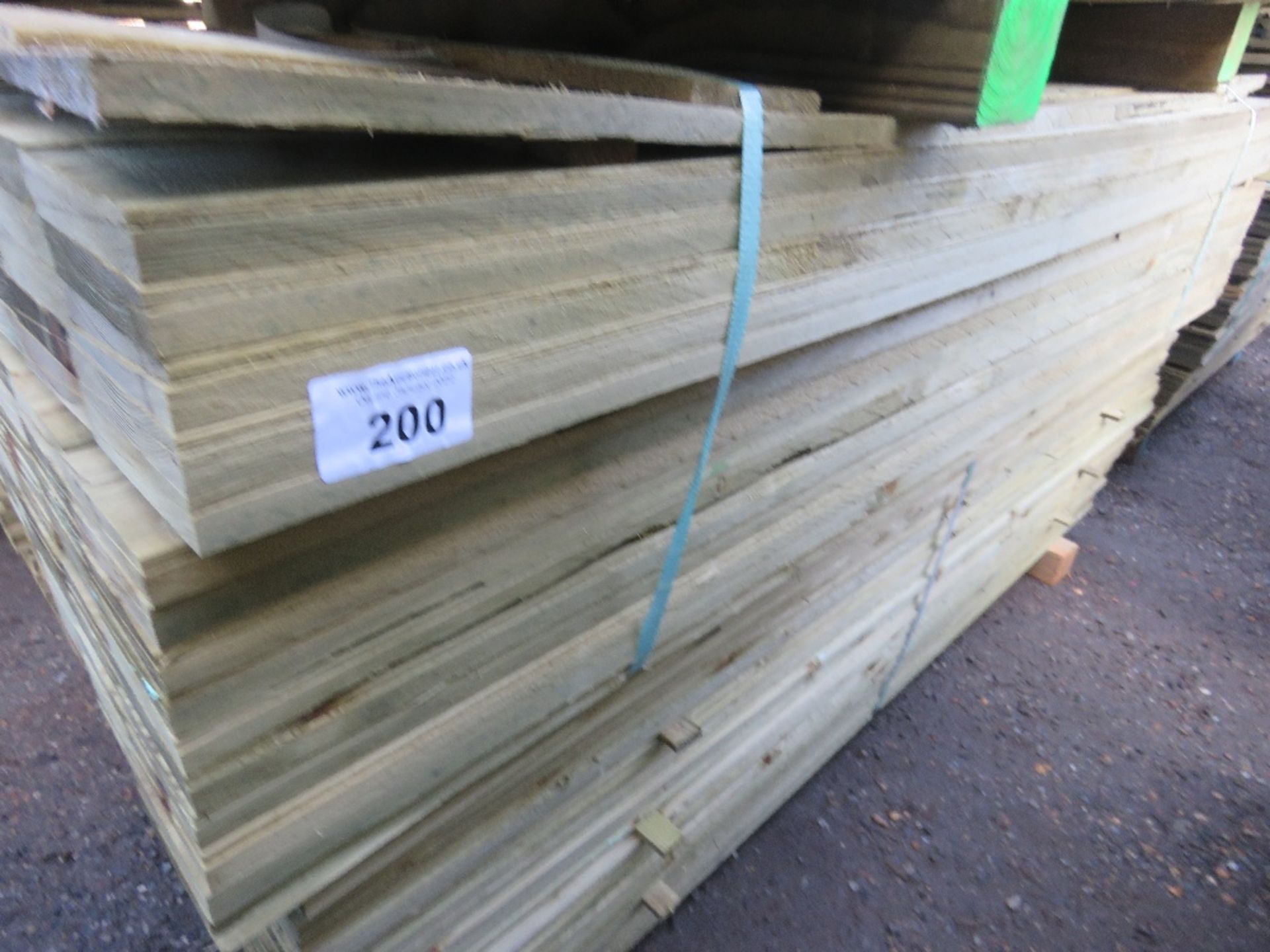 LARGE BUNDLE OF PRESSURE TREATED FEATHER EDGE TIMBER CLADDING: 1.8M LENGTH X 10CM WIDTH APPROX.