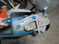 MAKITA PETROL SAW WITH A BLADE.