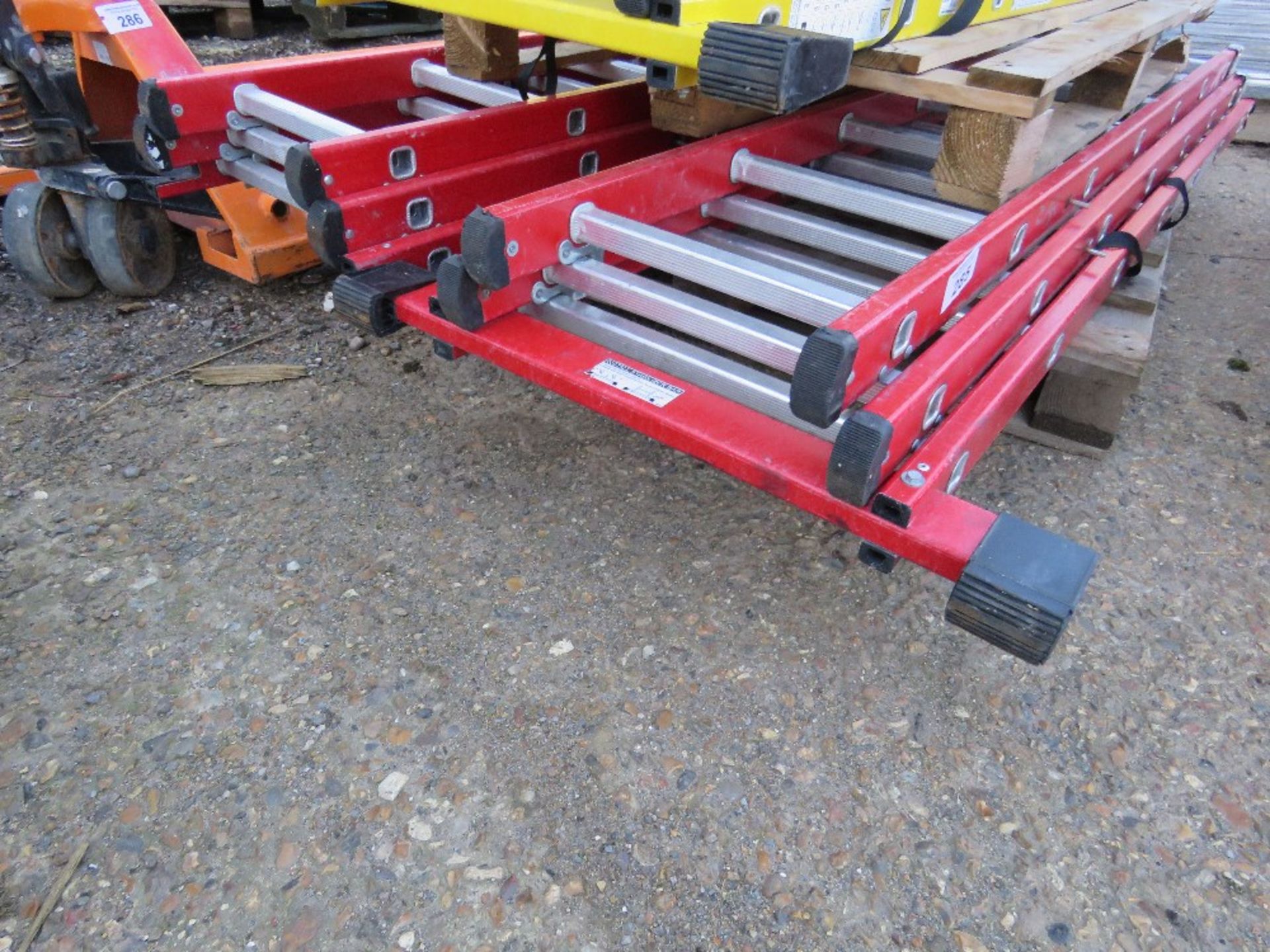 2 X RED GRP 3 STAGE EXTENDING LADDERS. NO VAT ON HAMMER PRICE.
