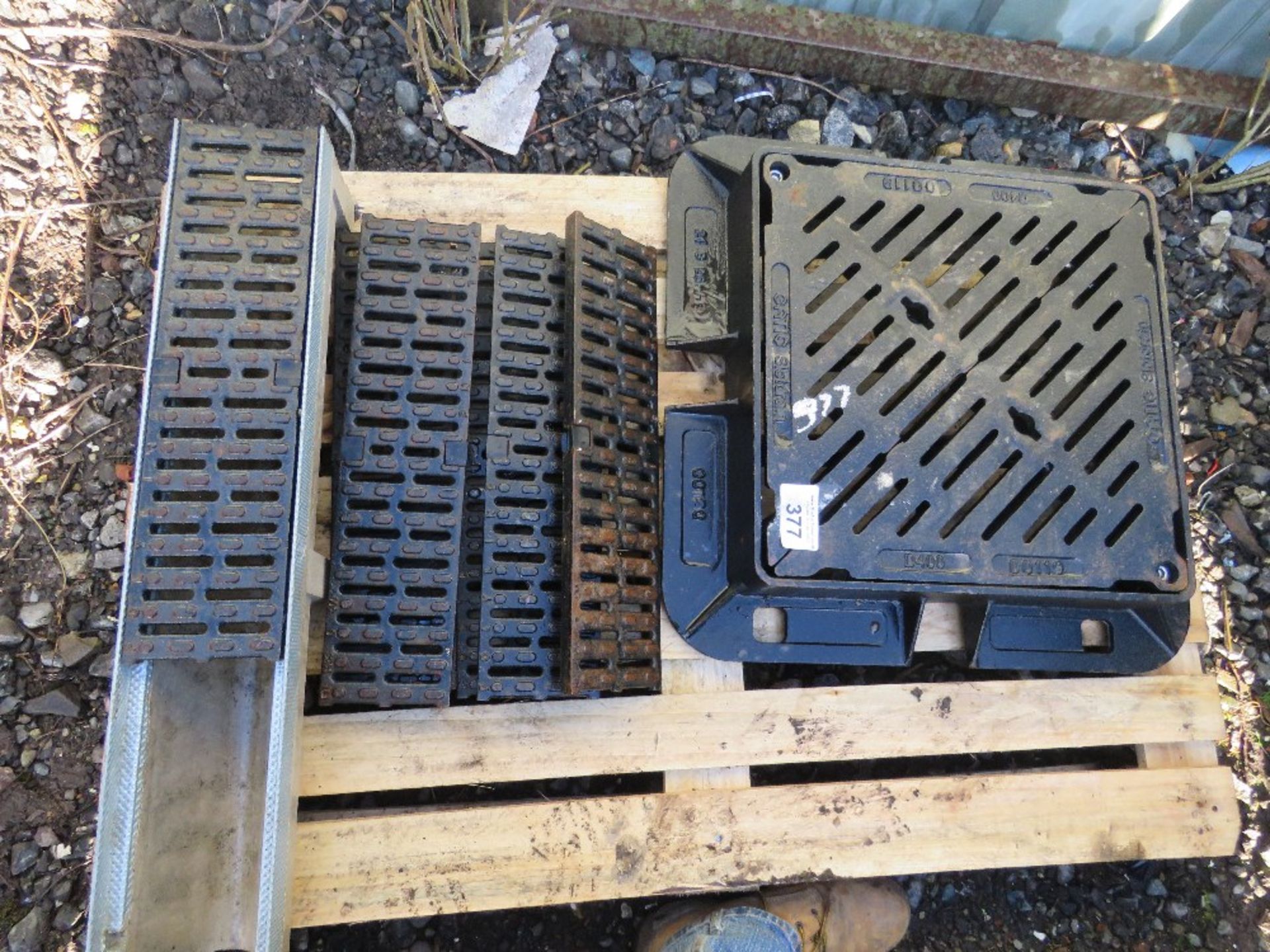 CAST IRON MANHOLE COVER AND SURROUND PLUS DRAINAGE CHANNELS.NO VAT ON HAMMER PRICE.