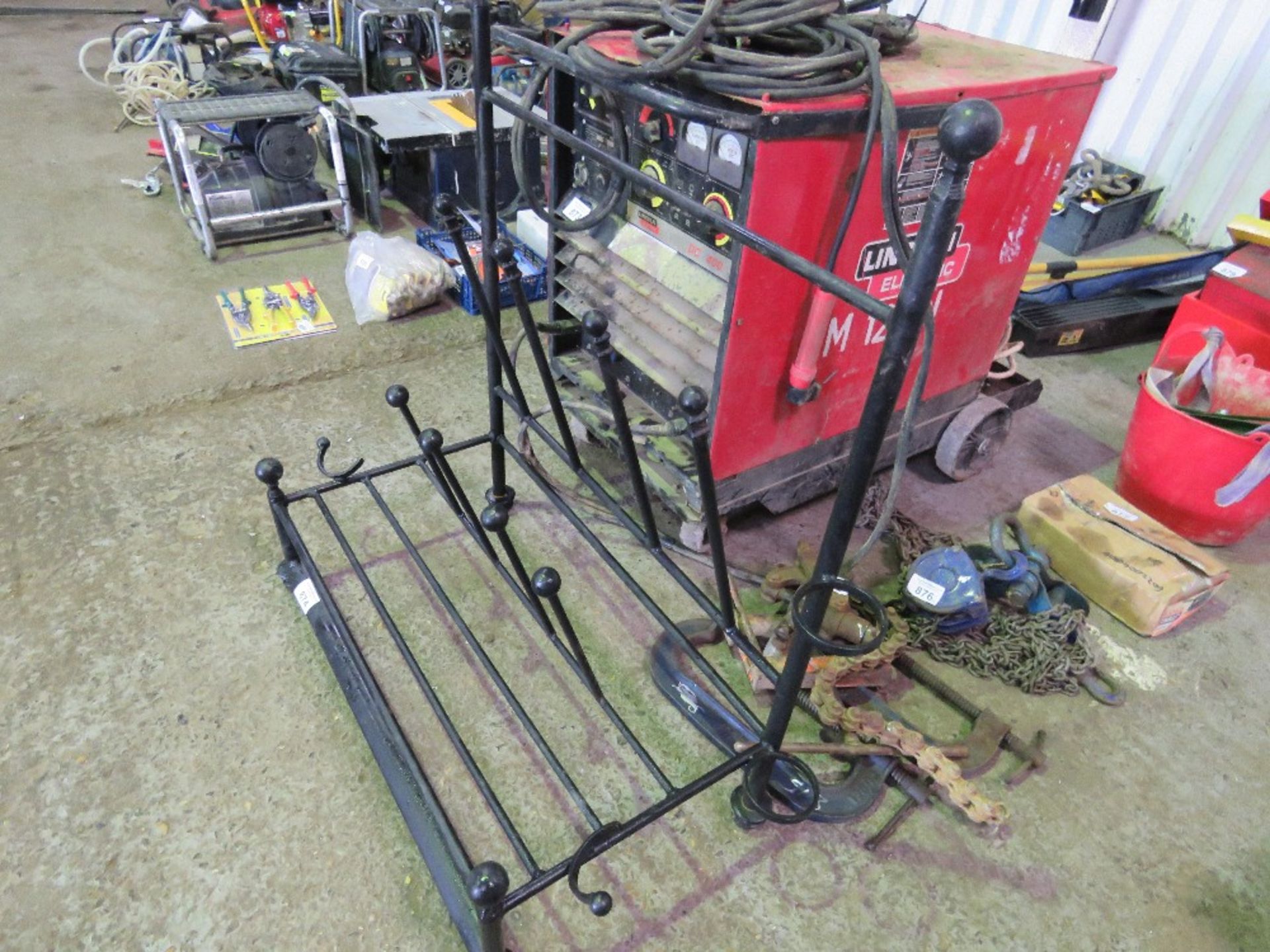 METAL BOOT AND SHOE STAND. NO VAT CHARGED ON THE HAMMER PRICE OF THIS LOT.