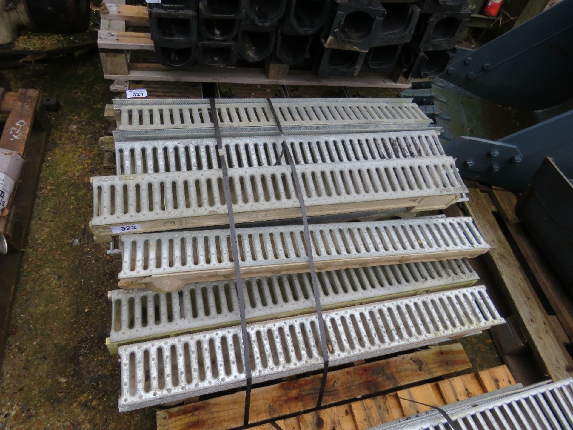 PALLET CONTAINING LIGHTWEIGHT METAL TOPPED DRAIN GULLEYS .
