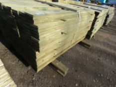 LARGE PACK OF PRESSURE TREATED FEATHER EDGE CLADDING TIMBER. LENGTH 1.50M X 100MM WIDTH APPROX.