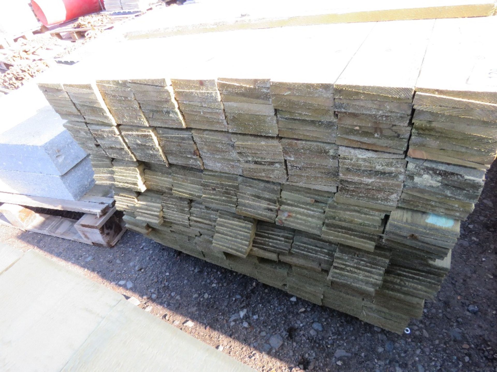 LARGE PACK OF PRESSURE TREATED FEATHER EDGE CLADDING TIMBER. LENGTH 1.35M X 100MM WIDTH APPROX. - Image 2 of 3