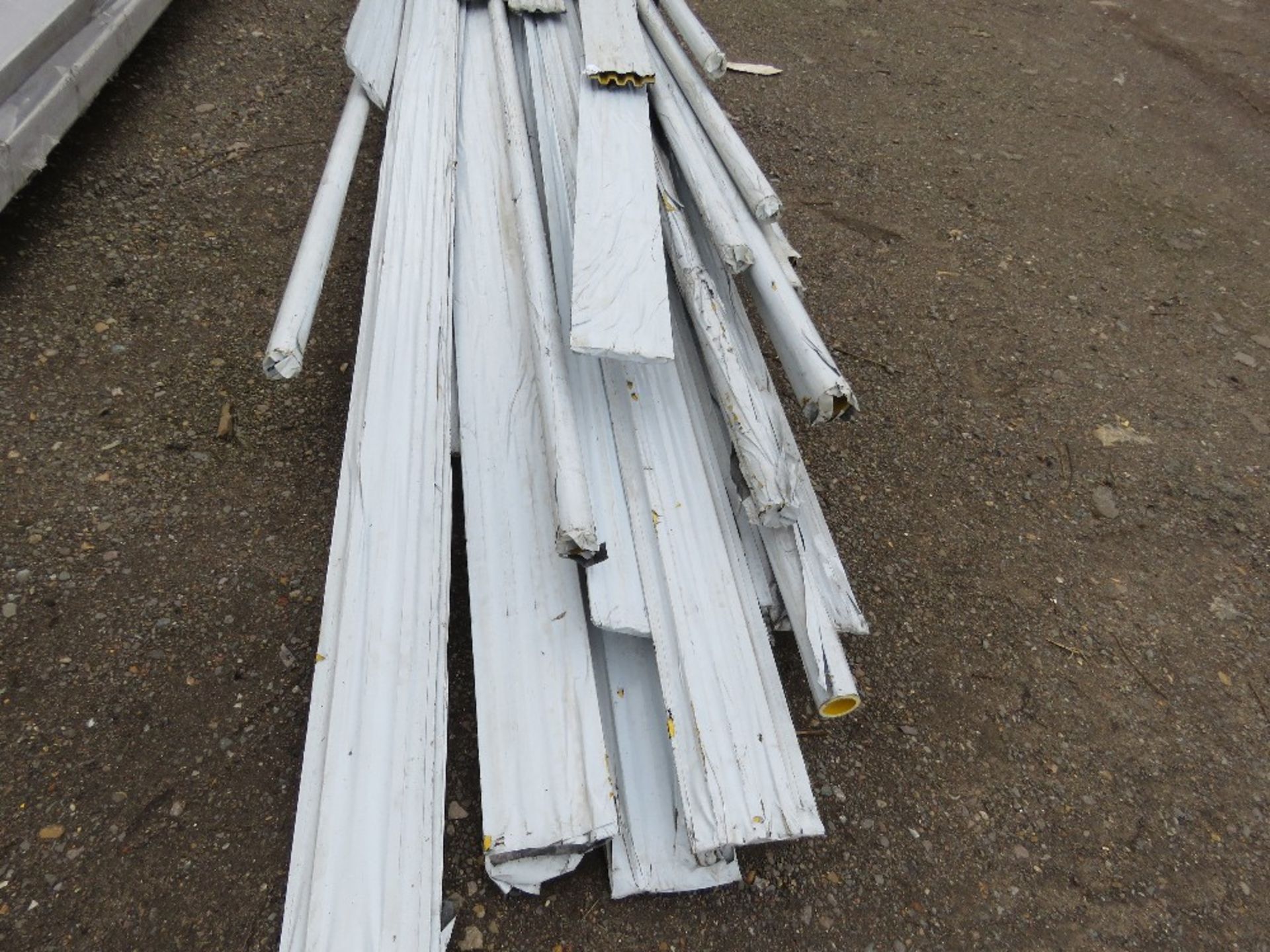 STILLAGE CONTAINING ASSORTED YELLOW PLASTIC CLADDING, 4FT - 20FT LENGTH APPROX. THIS LOT IS SOLD UND - Image 2 of 4