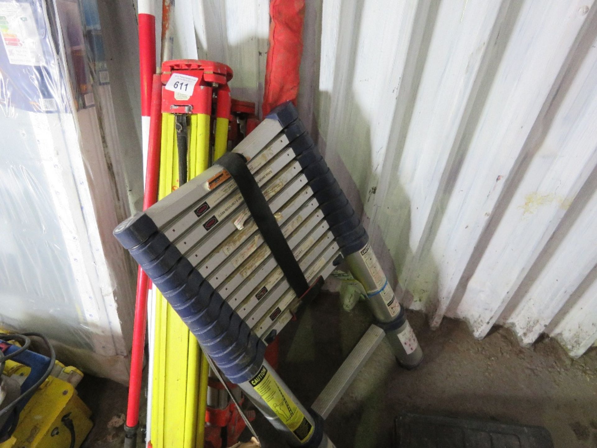 2 X SURVEY TRIPODS, POLES AND A MEASURING STAFF PLUS A TELESCOPIC LADDER (NEEDS ATTENTION)