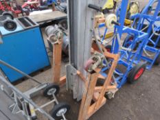 MATERIAL HOIST UNIT (genie style) WITH A SET OF FORKS. THIS LOT IS SOLD UNDER THE AUCTIONEERS MARGIN