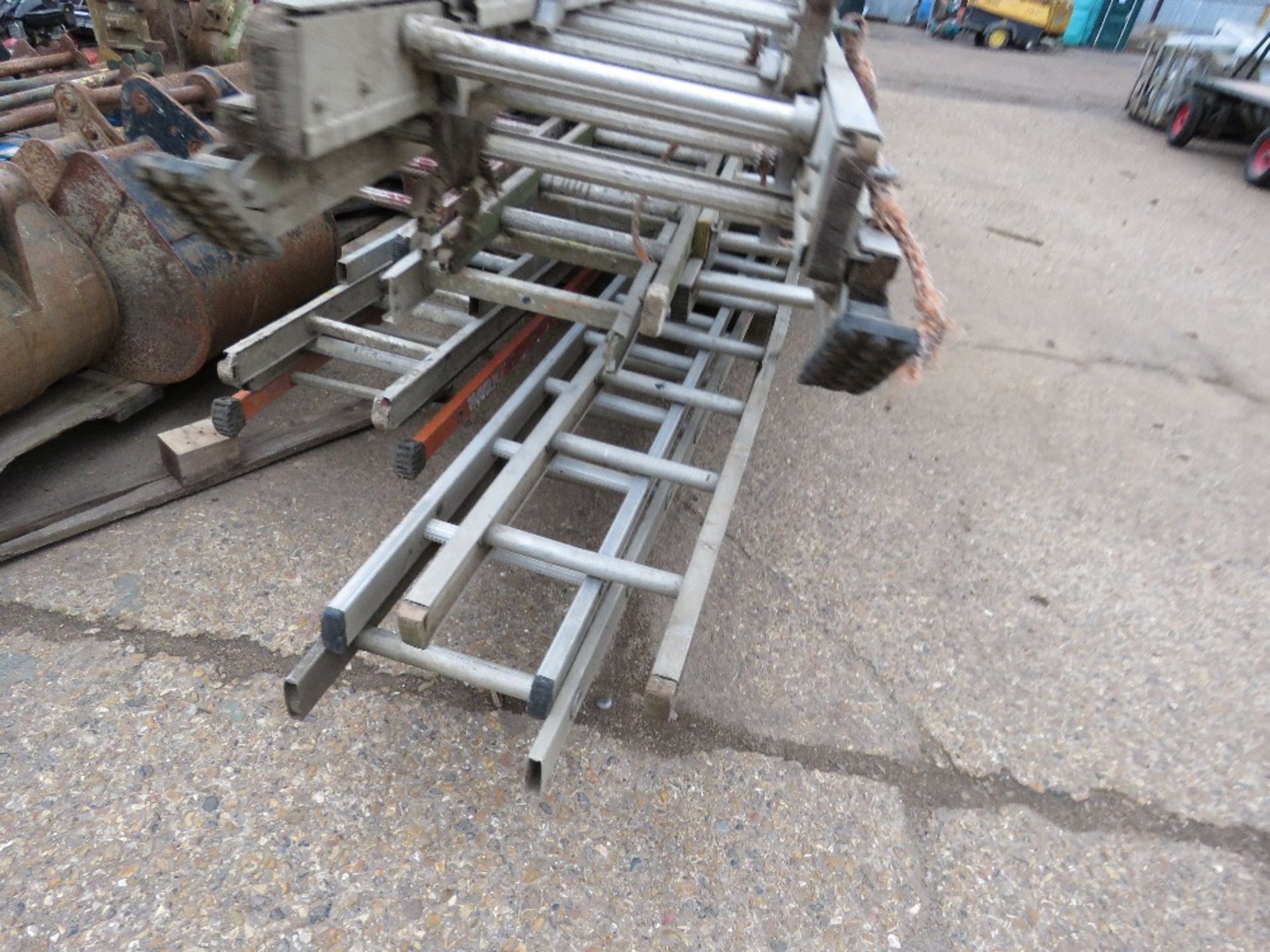 STACK OF ASSORTED LADDERS/LADDER SECTIONS, INCLUDING LARGE TRIPLE STAGE ALI LADDER. - Image 2 of 4